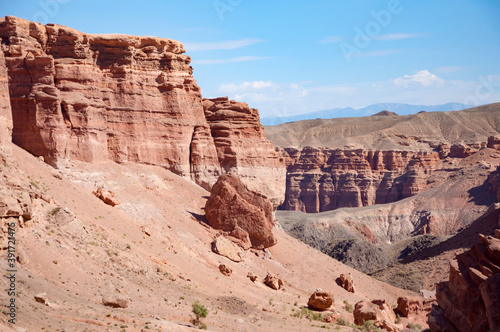 Picturesque view over Charyn canyon, a geological formation of amazing big red sand stone, with vivid blue sky, National natural park in Almaty region, Kazakhstan © Lina
