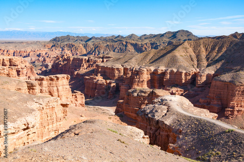 Picturesque view over Charyn canyon, a geological formation of amazing big red sand stone, with vivid blue sky, National natural park in Almaty region, Kazakhstan