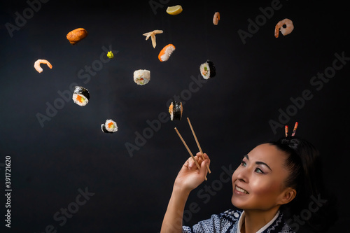Japaense Kimono model eating sushi with chopstick