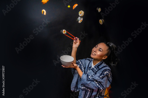 Japanese Kimono model eating sushi with chopstick