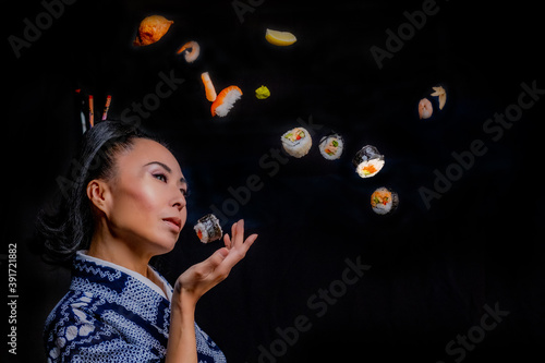 Japanese kimono model with sushi smiling