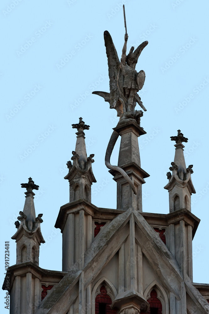 Fototapeta premium Sculpture of Saint George on top of St. Nicholas Roman Catholic Cathedral in Kyiv Ukraine