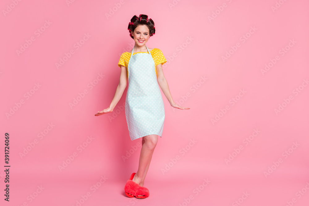 Full length photo of nice girl wear hair rollers clothes slippers isolated over pastel color background Full length photo of nice girl wear hair rollers clothes slippers isolated over pastel color background