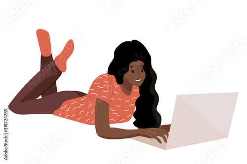 African American girl works lying down behind a laptop. Freelancer or student woman. Flat isolated vector illustration.