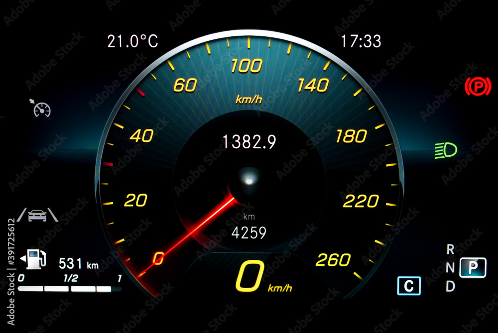 Car dashboard panel including speedometer with red needle, odometer, fuel gauge, lane assist icon, gear position indicator and dipped beam headlights. Modern car digital LCD instrument cluster. Car dashboard panel including speedometer with red needle, odometer, fuel gauge, lane assist icon, gear position indicator and dipped beam headlights. Modern car digital LCD instrument cluster.