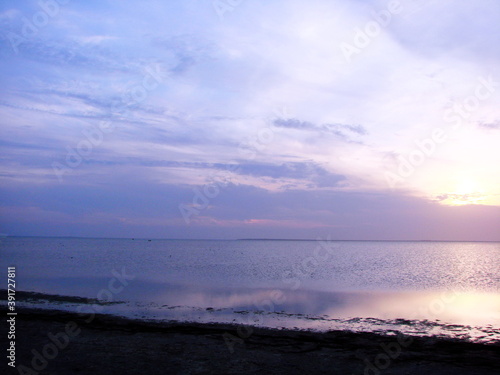 Boundless natural color palette of sunset over Lake Sivash.