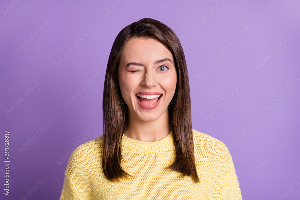 Fototapeta premium Photo portrait of winking young girl with closed eye smiling isolated on bright color purple background