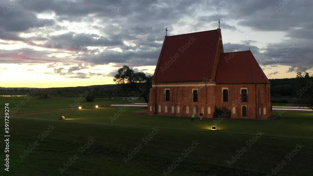 Zapyskis St. John the Baptist church in the evening. Kaunas district, drone aerial view Zapyskis St. John the Baptist church in the evening. Kaunas district, drone aerial view