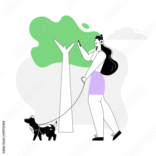 Woman walking dog and listening music on headphones