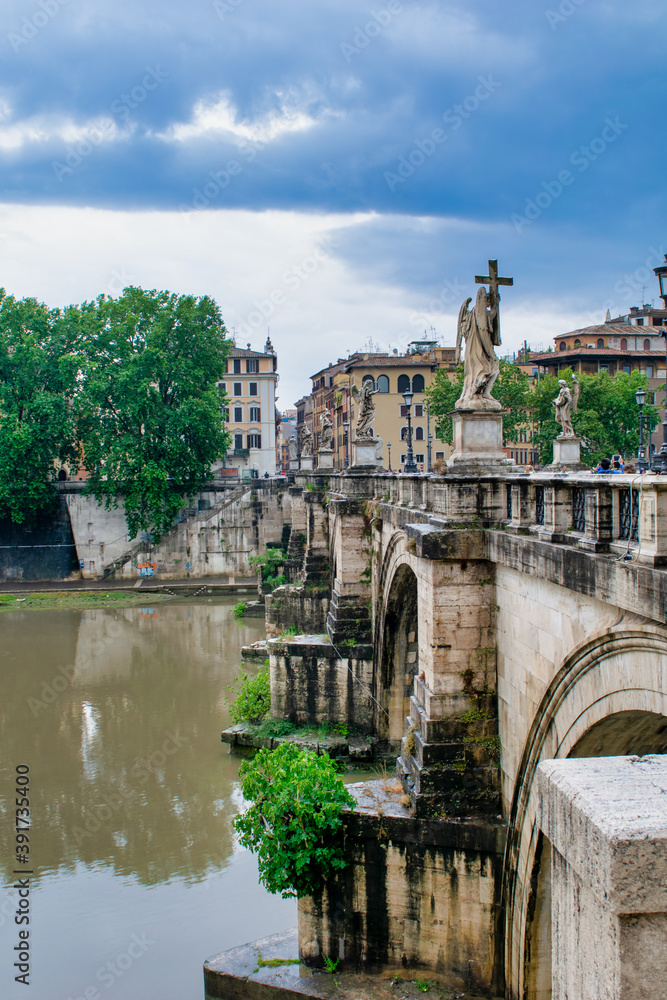 ROME, ITALY - JUNE 2014: Tourists enjoy the beautiful Saint Angel Bridge