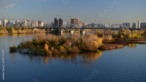 Nice evening panoramic view of Dnipro river with island Ostriv Malyy and bridge from Paton bridge in Kiev, Ukraine photo