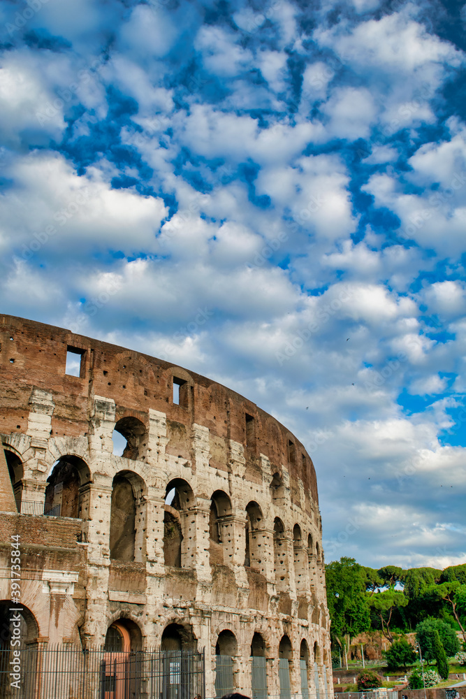 The Colosseum and the homonymous square on a summer day, Rome, Italy