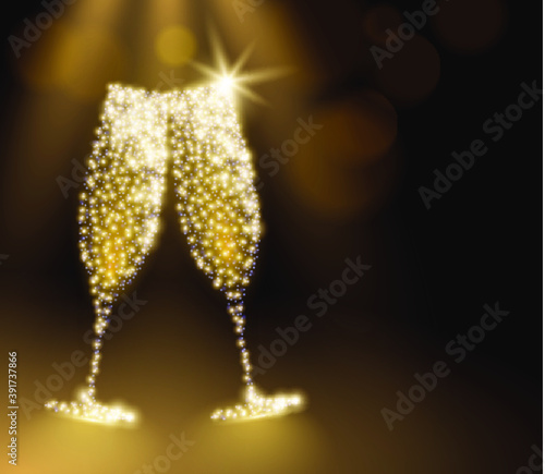 Two glittering champagne flute toasting in a dark backdrop with gold colored bokeh lights and space for text. Happy new year's party greeting card