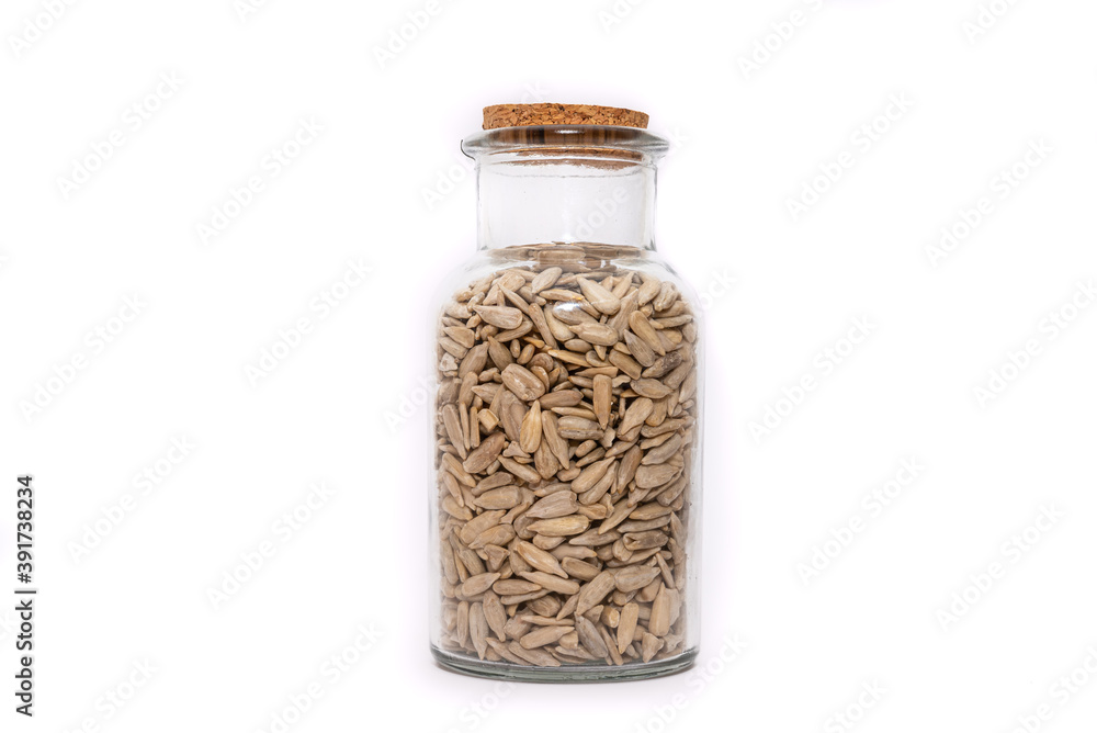 A Jar of dried Sunflower seed isolated on a white background, nutritious seeds dried and stored. Healthy food choice. A Jar of dried Sunflower seed isolated on a white background, nutritious seeds dried and stored. Healthy food choice.