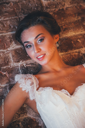 Wedding day and beautiful bride in studio. Closeup portrait of young gorgeous bride. Wedding.