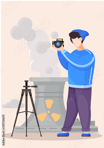 Guy standing and adjusting the lens. Photographic art. A cameraman prepares camera for a photo shoot. Photographer with camera takes picture of the radioactive plant. Factories pollute the environment