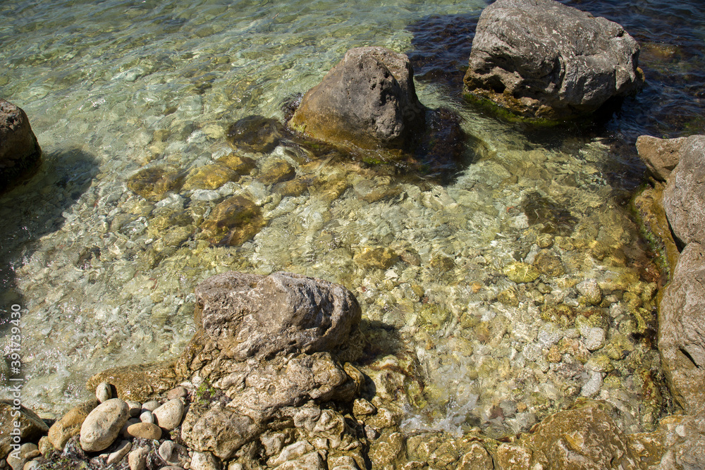 seashore with stones and waves seashore with stones and waves