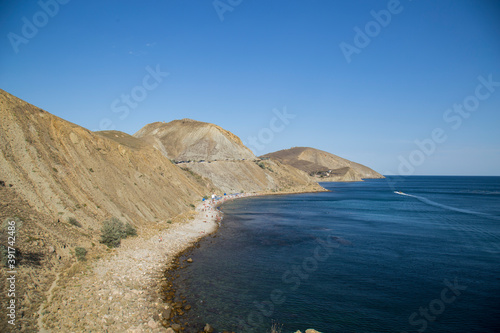 seashore sandwiched into a bay by rocks