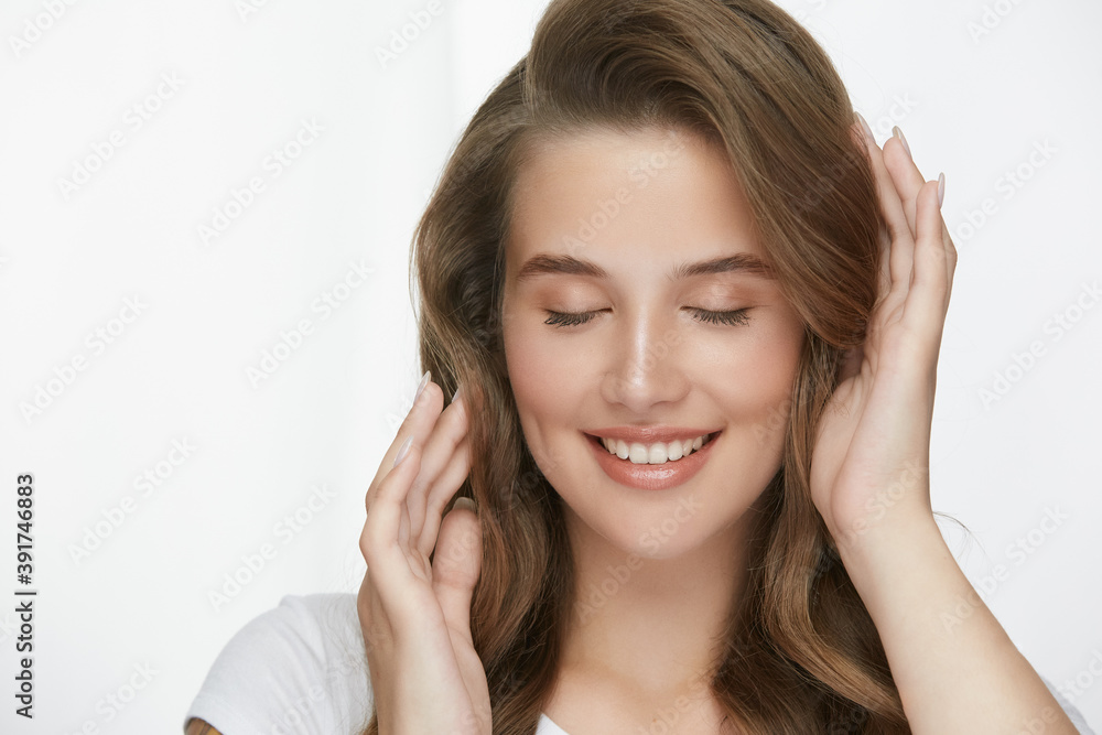 lovely girl touching hair with her eyes closed lovely girl touching hair with her eyes closed