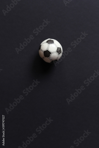 Mini soccer ball on black background.