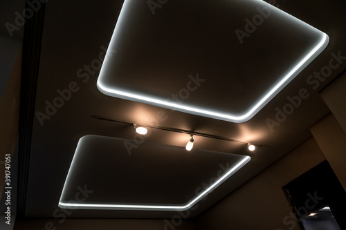 Beautiful stretch ceiling with led lighting. Two squares and lights