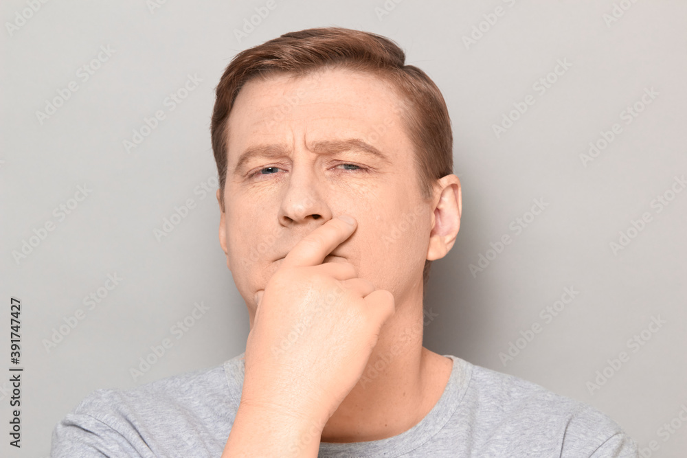 Portrait of thoughtful focused man with serious expression on face