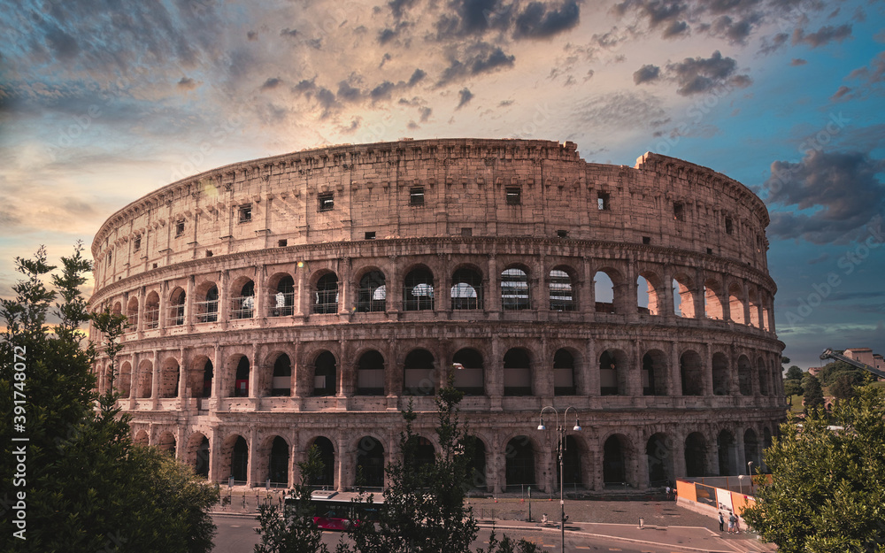 Fototapeta premium road to Colosseum ancient arena under dramatic sky, Rome Italy