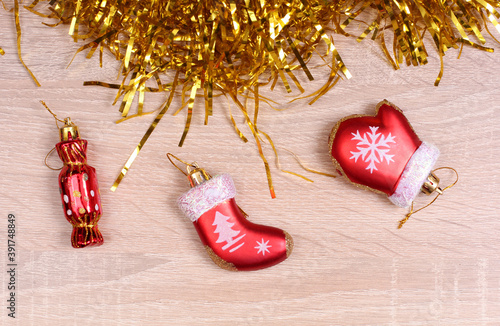 Christmas decoration baubles with branches of fir tree on wooden background photo