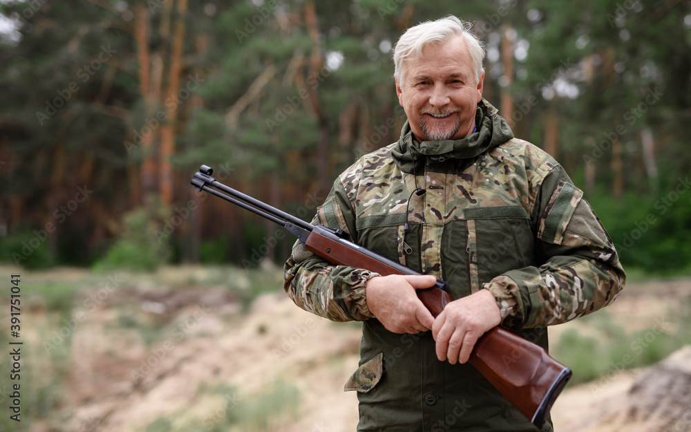 Happy Hunter Old Man in Camouflage with Shotgun. Happy Hunter Old Man in Camouflage with Shotgun.