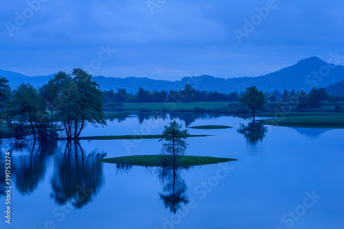 Blue evening lake reflections
