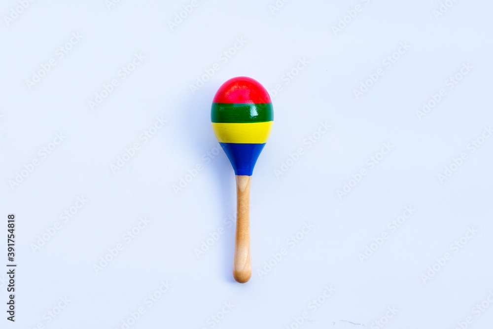 Wooden rattle on white background. Copy space Wooden rattle on white background. Copy space