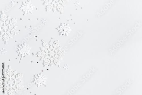 Christmas composition. Christmas frame made of snowflakes on pastel gray background. Winter concept. Flat lay, top view