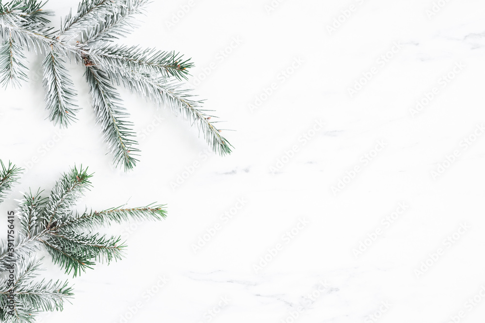 Christmas composition. Fir tree branches on marble background. Christmas, winter, new year concept. Flat lay, top view, copy space Christmas composition. Fir tree branches on marble background. Christmas, winter, new year concept. Flat lay, top view, copy space