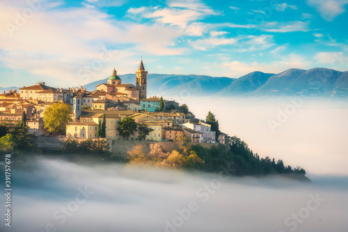 Trevi picturesque village in a foggy morning. Perugia, Umbria, Italy. photo