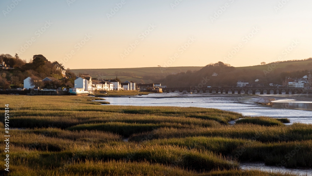 Mellow evening sunlight over the Torridge Estuary looking towards Bideford. Mellow evening sunlight over the Torridge Estuary looking towards Bideford.