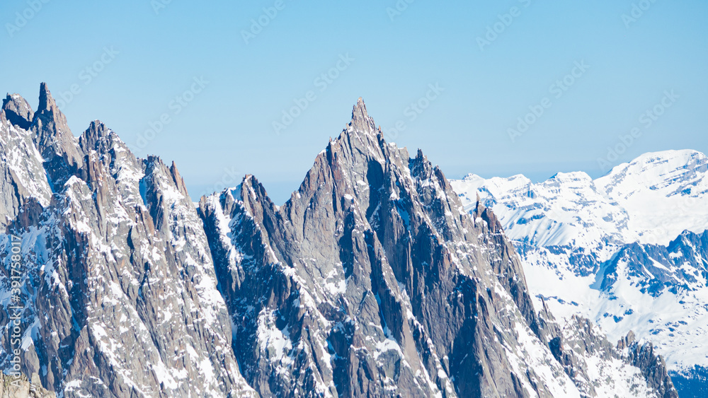 Sharpened peaks with snow and glaciers in the Monte Bianco (meaning 
