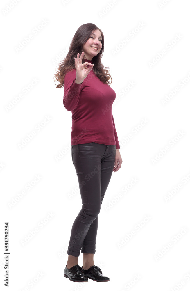in full growth. casual young woman pointing at you in full growth. casual young woman pointing at you