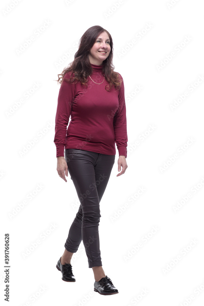 in full growth. happy young woman striding forward in full growth. happy young woman striding forward
