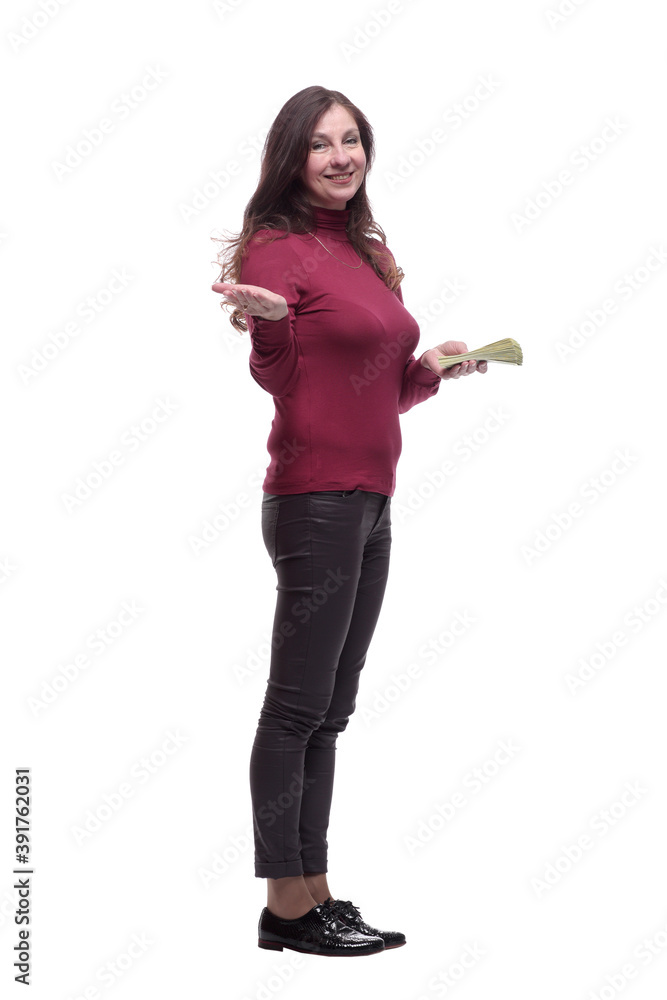 in full growth. casual young woman with a bundle of banknotes in full growth. casual young woman with a bundle of banknotes