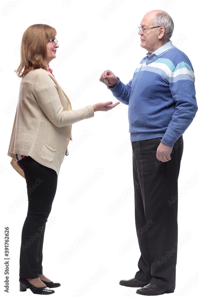 Real estate agent handing the keys to the new owner. Real estate agent handing the keys to the new owner.