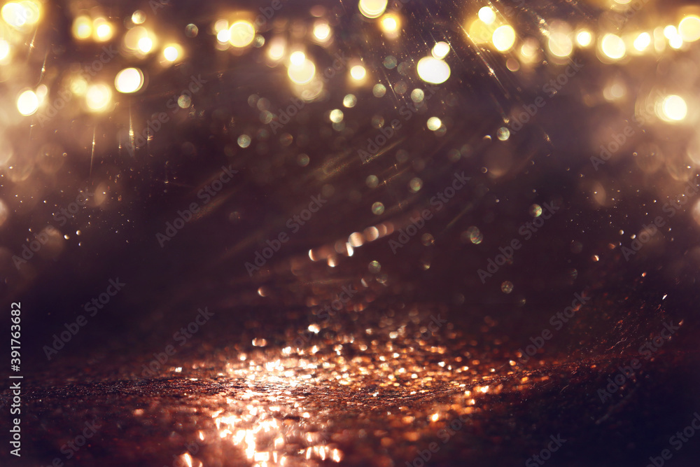 background of abstract gold and black glitter lights. defocused background of abstract gold and black glitter lights. defocused