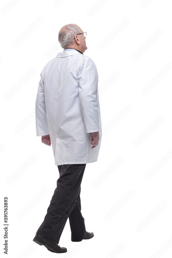 rear view. senior doctor with stethoscope striding forward rear view. senior doctor with stethoscope striding forward