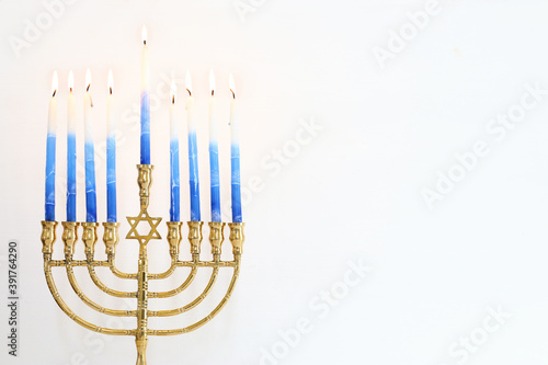 Religion image of jewish holiday Hanukkah background with menorah (traditional candelabra) and candles