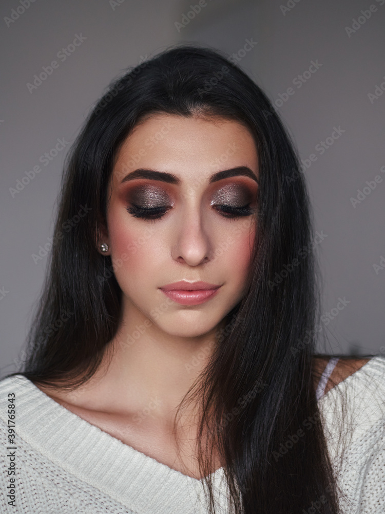 Magnificent portrait of a beautiful brunette young woman with perfect skin makeup closeup Magnificent portrait of a beautiful brunette young woman with perfect skin makeup closeup