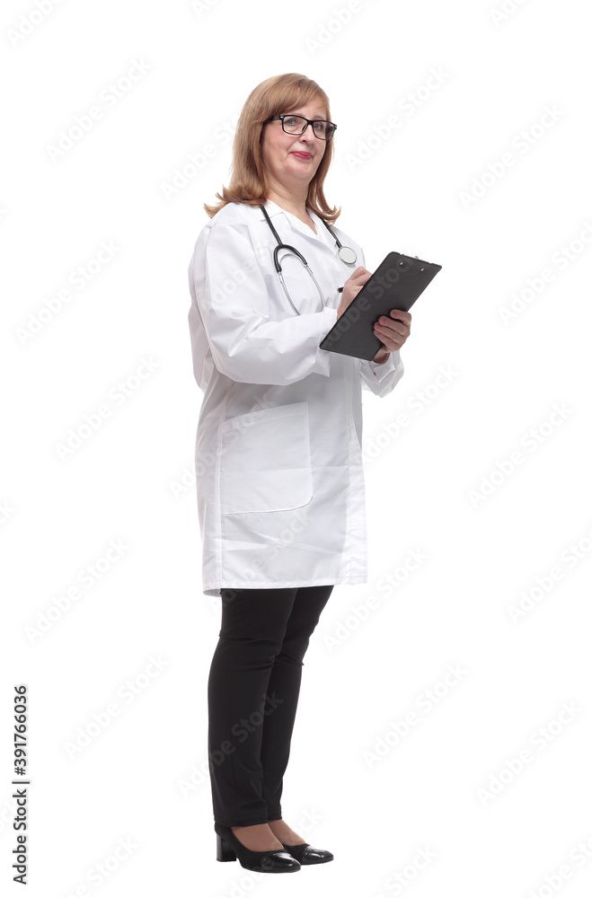 qualified female doctor making notes in the clipboard. qualified female doctor making notes in the clipboard.