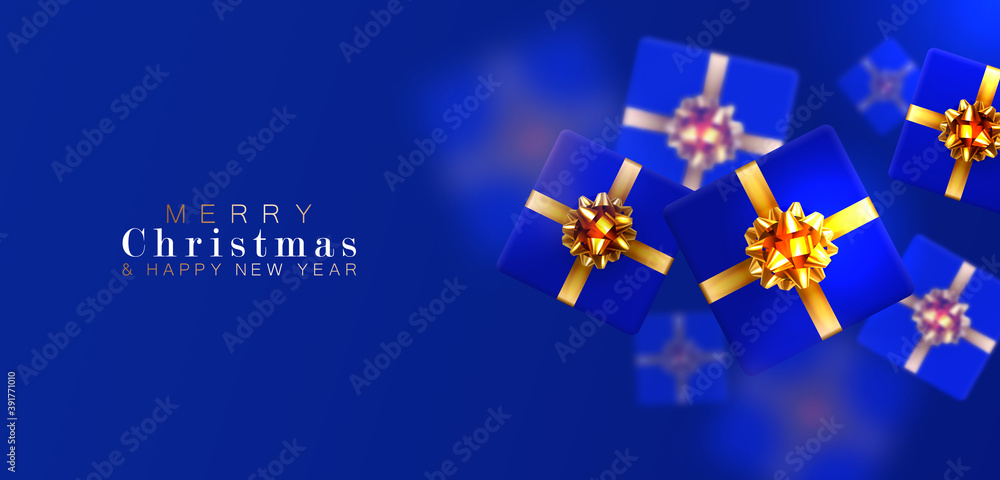 Gift box with motion blur effect. Merry Christmas and Happy New year. Realistic background with voluminous blue gifts tied with a gold ribbon with bows. The view from the top. Horizontal arrangement. Gift box with motion blur effect. Merry Christmas and Happy New year. Realistic background with voluminous blue gifts tied with a gold ribbon with bows. The view from the top. Horizontal arrangement.
