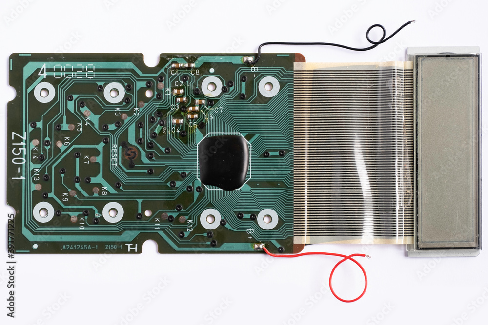 Fototapeta premium Electronic circuit board of an electronical calculator with many electrical components