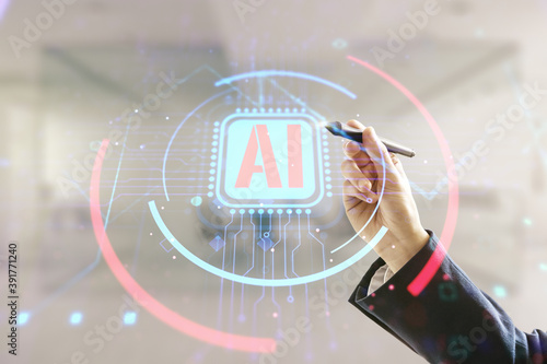 Double exposure of businessman hand with pen working with creative artificial Intelligence abbreviation hologram on blurred office background. Future technology and AI concept