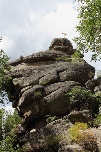 Rock with an Orthodox cross on top of Mount Tserkovka, Altai Mountains, Belokurikha city, Russia
