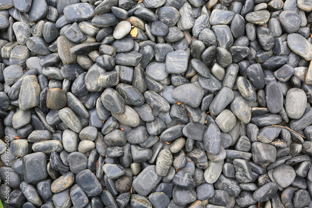 Black pebble stone on ground for texture background. Black pebble stone on ground for texture background.